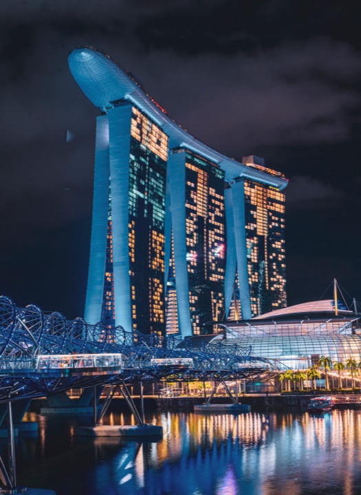 Marina Bay Sands hotel lit at night above the bay